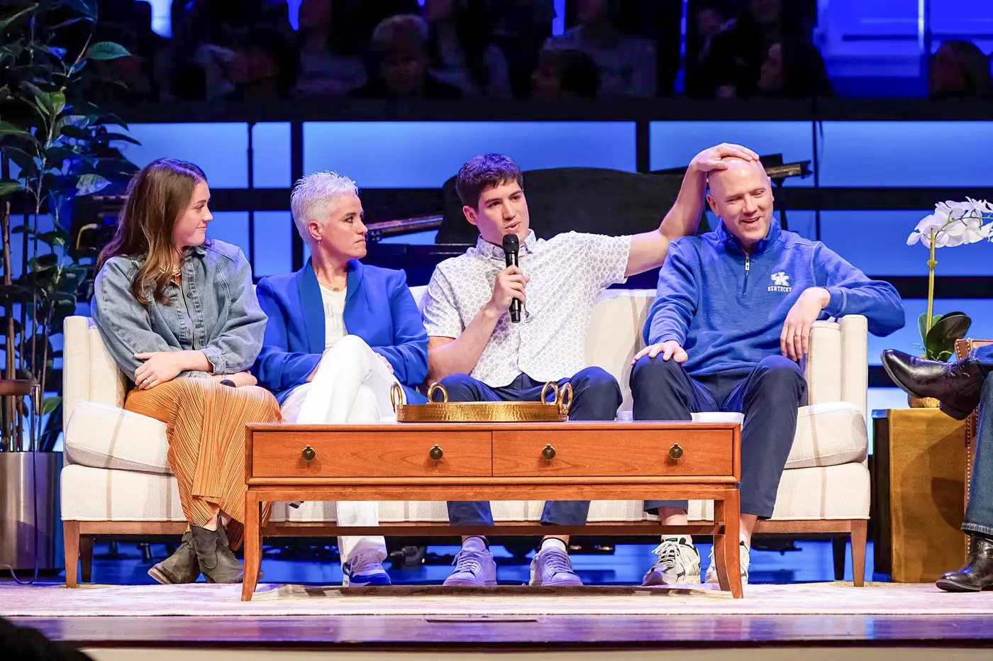 The Sheppard family sharing their story together on stage
